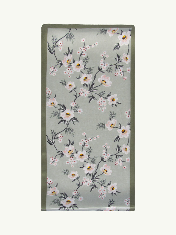 Narrow double-sided shawl in soft green with subtle floral pattern 15 cm x 145 cm